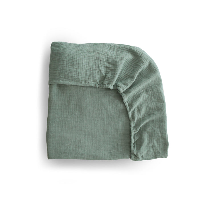 mushie crib sheet roman green